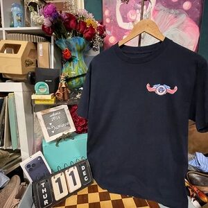 Chris Kyle Shirt featuring the signature bone frog on an American Flag backgroun